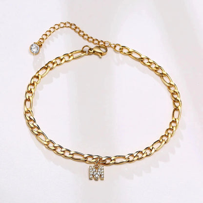 Mandotos crystal A-Z letter initial anklet for women with Cuban link stainless steel design and beach-ready style.