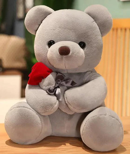 Mandotos Cuddly Rose Teddy Pillow with red rose detail and plush bear in 25, 35, or 45 cm size, soft and decorative.