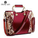 Mandotos elegant floral leather tote in burgundy with embroidered details and a detachable crossbody strap.