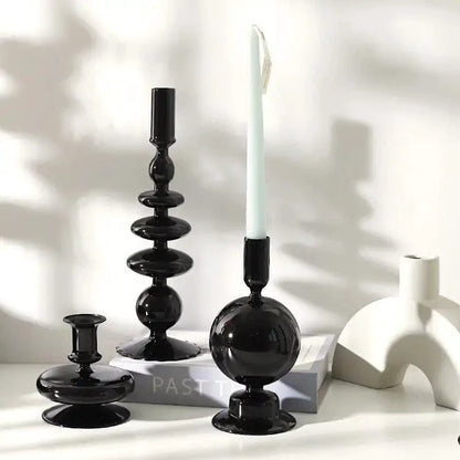 Mandotos black glass candlestick holder with elegant Rue design, perfect as table decor or a stylish gift centerpiece.