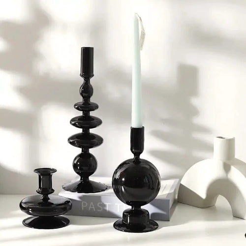 Mandotos black glass candlestick holder with elegant Rue design, perfect as table decor or a stylish gift centerpiece.