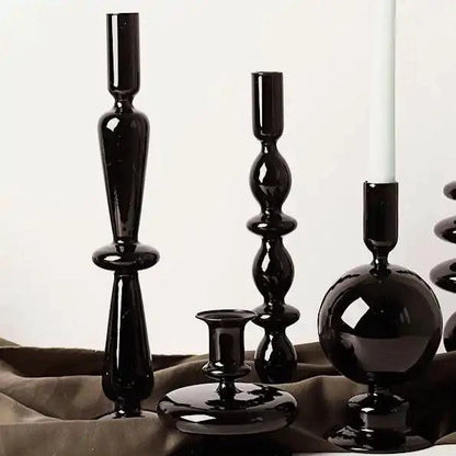 Mandotos Elegant Rue black glass candlestick holder on a table, stylish centerpiece and gift idea for home decor.