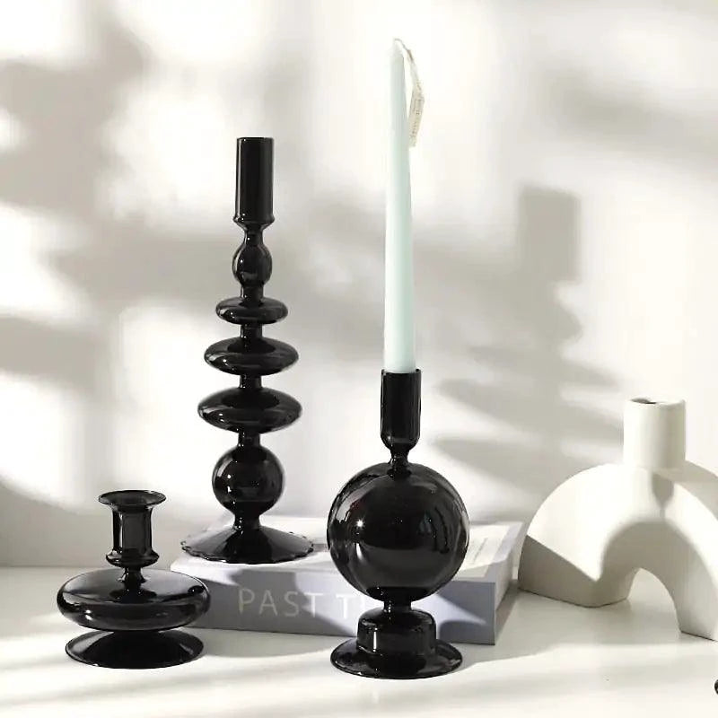 Mandotos Elegant Rue black glass candlestick holder on a table, stylish centerpiece for home decor or gift idea.