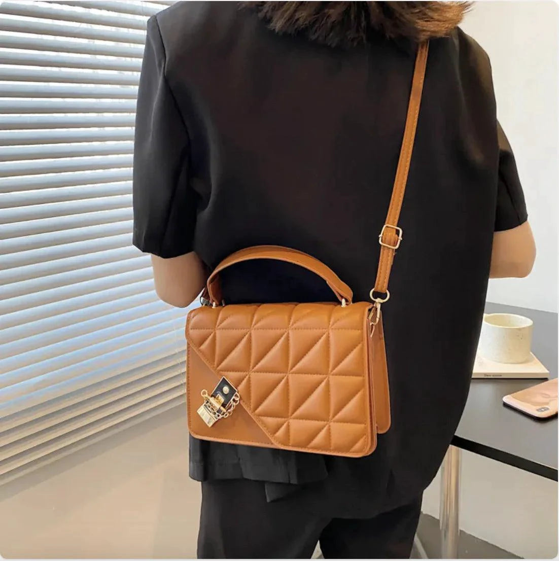 Black MANDOTOS Rhombus Pattern PU Leather Shoulder Bag, compact messenger style with zipper closure, 22x14x7 cm.