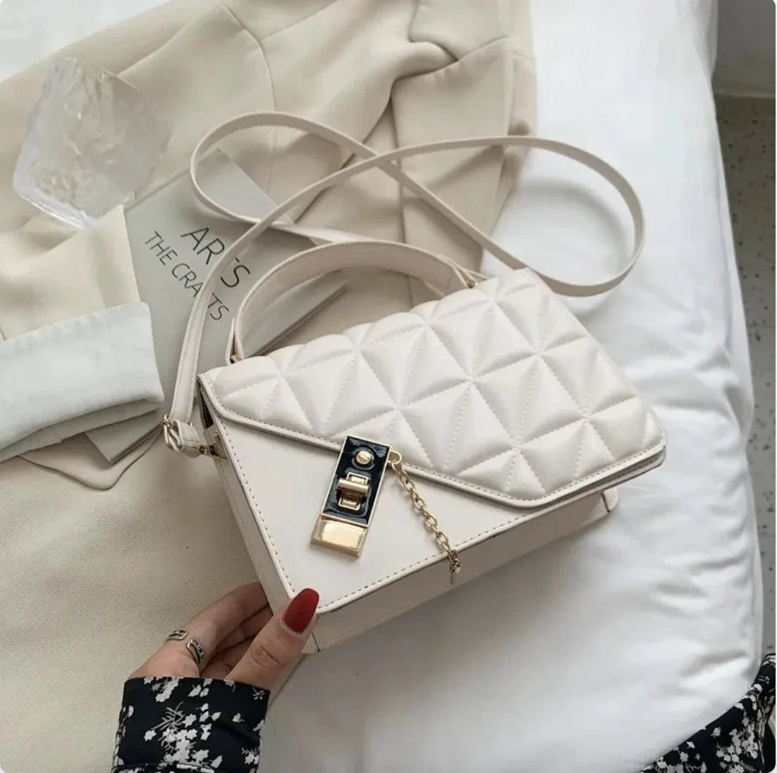 Mandotos black rhombus pattern PU leather shoulder bag with zipper closure, compact messenger style, 22x14x7 cm for everyday use.
