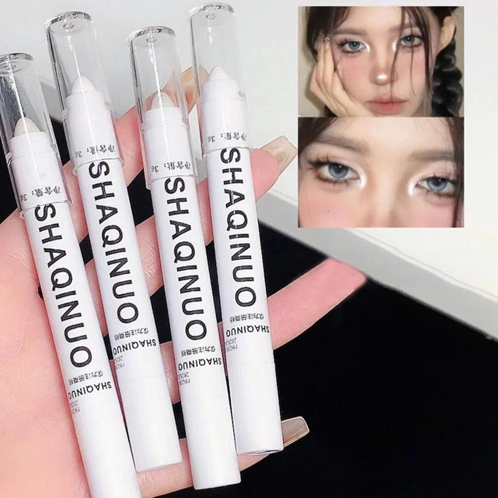 Mandotos matte eyeshadow stick with white eyeliner and shimmering silver highlighter in a cream formula, displayed on a neutral background.