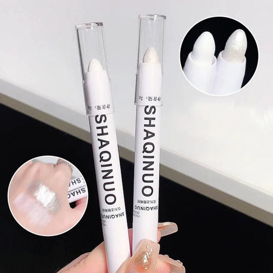 Mandotos matte eyeshadow stick with white eyeliner and shimmer silver highlighter in a cream formula, shown in the image.