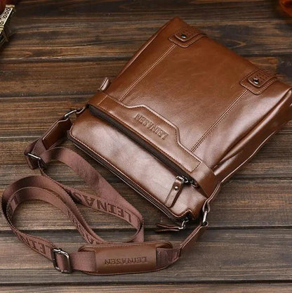 Mandotos men's messenger bag made of durable leather with adjustable strap, featuring front pocket and classic design.