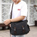 Men's canvas shoulder bag by MANDOTOS, multifunctional messenger bag with adjustable strap and multiple compartments.