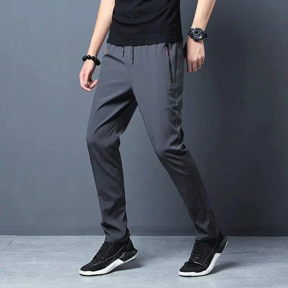 Mandotos men's casual slim fit jogger pants in blue, black, and gray with elastic waist, classic Korean style, plus size trousers.