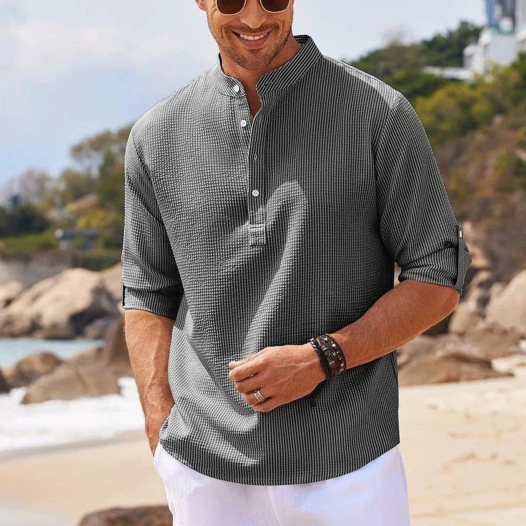 Men's casual long sleeve shirt by MANDOTOS with stand collar and solid color, suitable for everyday men's clothing style.