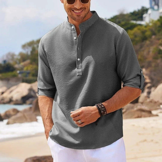 Men's casual long sleeve shirt by MANDOTOS with stand collar and solid color, suitable for everyday men's clothing style.