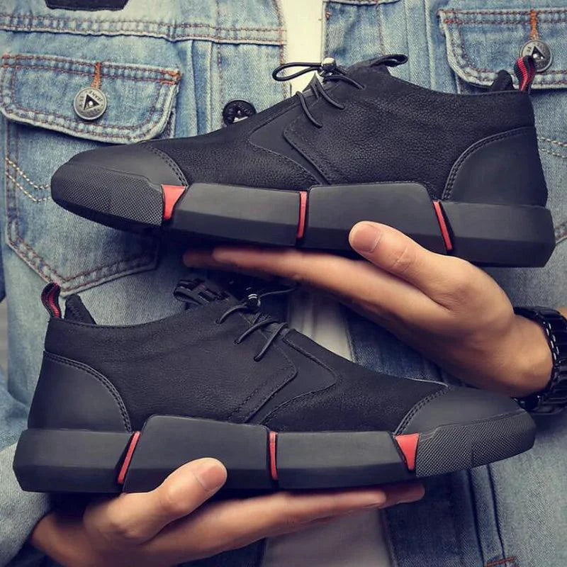 Men's chic leather sneakers by MANDOTOS featuring stylish design and comfortable fit, shown in a close-up of the footwear.