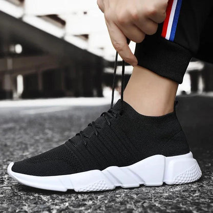Men's cushioned running shoes by MANDOTOS with breathable mesh upper and supportive sole for comfort and performance.
