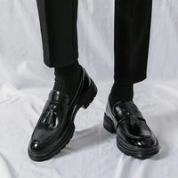 Men's elegant breathable tassel loafers by MANDOTOS, featuring sleek design and comfortable fit, shown in a stylish close-up image.