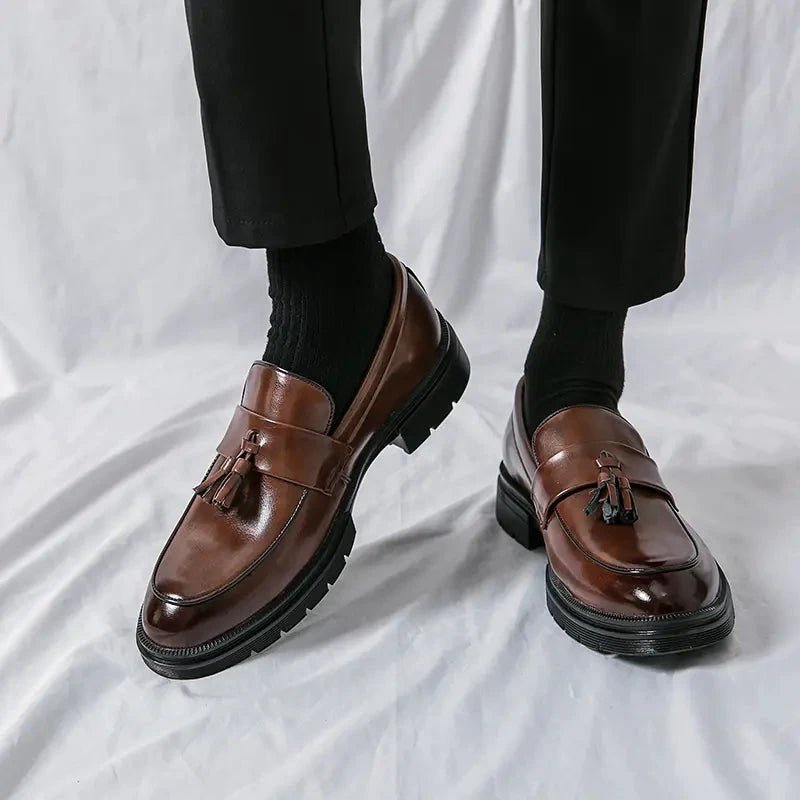 Men's elegant breathable tassel loafers by MANDOTOS, featuring sleek design and comfortable leather upper for stylish wear.