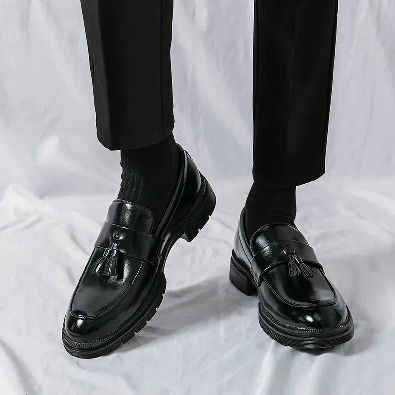 Men's elegant breathable tassel loafers by MANDOTOS, showcasing stylish leather loafers with tassel details on a neutral background.