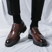 Men's elegant breathable tassel loafers by MANDOTOS, featuring leather material and stylish tassel detailing.