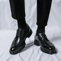 Men's elegant breathable tassel loafers by MANDOTOS, featuring sleek leather design and decorative tassels for stylish comfort.