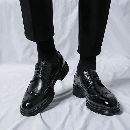 Men's elegant breathable tassel loafers by MANDOTOS, featuring sleek leather design and decorative tassels for stylish comfort.