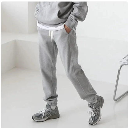 Men's hooded sports sweatshirt by MANDOTOS featuring a comfortable fit, casual style, and a front pocket, shown in dark gray.