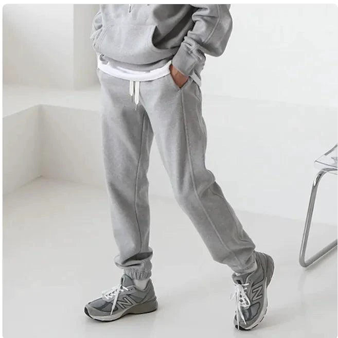 Men's hooded sports sweatshirt by MANDOTOS, featuring a comfortable fit, drawstring hood, and athletic style in a casual setting.