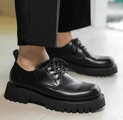 Men's leather Martin shoes by MANDOTOS with thick cushioned soles, stylish lace-up design, and polished finish.