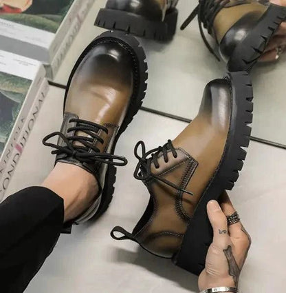 Men's leather Martin shoes by MANDOTOS with a thick cushioned sole, stylish ankle-high design and lace-up closure.