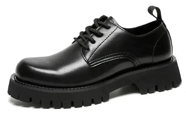 Men's leather Martin shoes by MANDOTOS with thick cushioned soles, stylish design, and polished black finish.