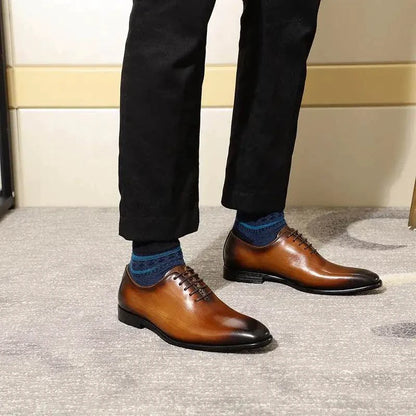 Men's brown leather Oxford shoes by MANDOTOS, featuring sleek design and polished finish for formal occasions.