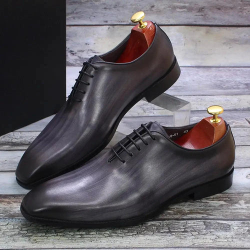 Mandotos men's leather Oxford shoes showing classic design, polished brown leather, and lace-up style for formal wear.