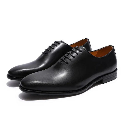 Men's black leather Oxford shoes by MANDOTOS, polished formal footwear with classic lace-up design and sleek finish.