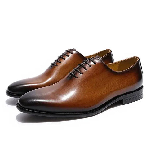 Men's black leather Oxford shoes by MANDOTOS featuring sleek design and polished finish, ideal for formal or business wear.