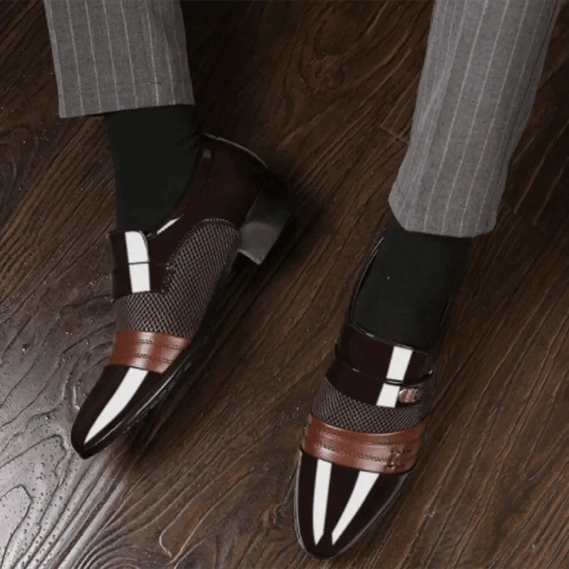 Men's luxury leather loafers by MANDOTOS featuring sleek design, polished finish, and classic slip-on style.