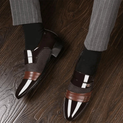Men's luxury leather loafers by MANDOTOS featuring sleek design, polished finish, and classic slip-on style.