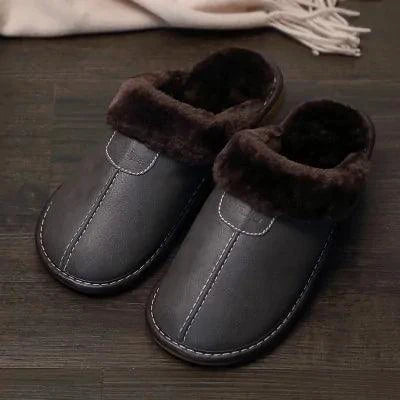Men's luxury leather slippers by MANDOTOS featuring soft leather and comfortable slip-on design.