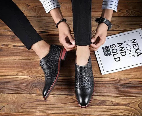 Men's pointed leather dress shoes by MANDOTOS, featuring sleek Korean style, elegant design, and polished black leather finish.