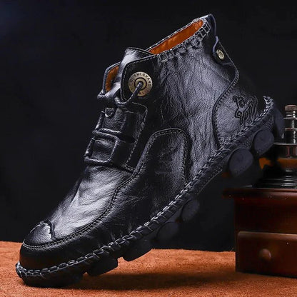 Men's stylish ankle boots by MANDOTOS featuring leather design, rounded toe, and low heel, perfect for casual or smart occasions.