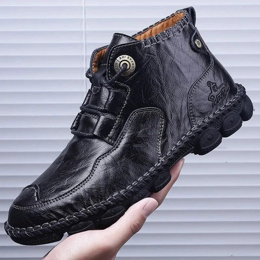 Men's stylish ankle boots by MANDOTOS featuring sleek leather design and modern silhouette, perfect for casual or smart outfits.