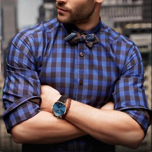 Men's MANDOTOS watch with a sleek black strap and round dial, featuring minimalist design and silver accents.