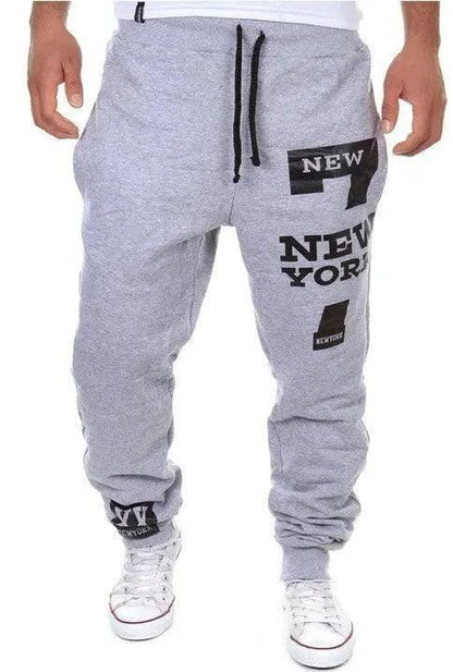 Men's MANDOTOS joggers in black with elastic waistband and tapered fit, made of comfortable stretch fabric.