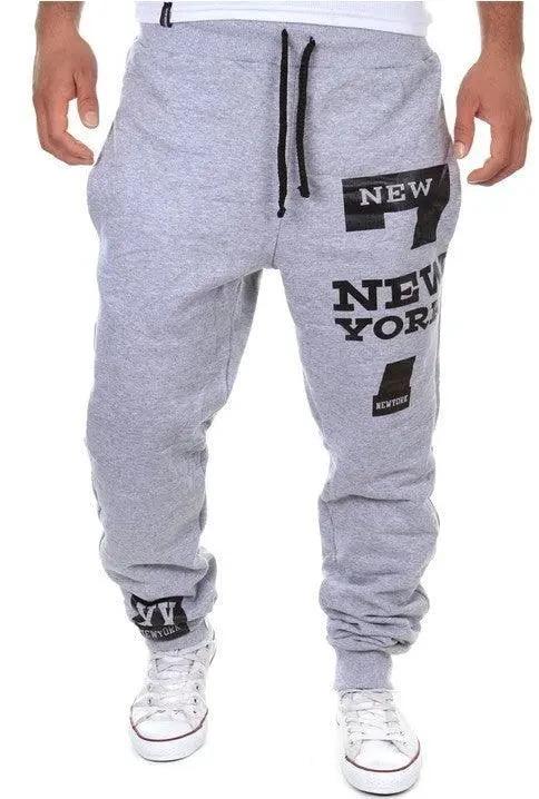 Men's MANDOTOS joggers in black with elastic waistband and tapered fit, made of comfortable stretch fabric.