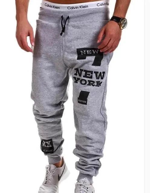 Men's joggers from MANDOTOS featuring comfortable fabric and modern fit, shown in a casual pose against a neutral background.