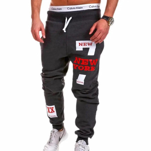 Mens black joggers by MANDOTOS, featuring a relaxed fit and elastic waistband, displayed on a neutral background.