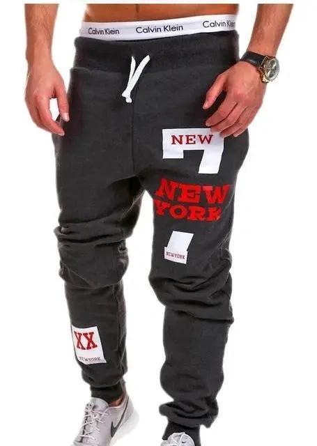 Mandotos men's joggers in black, featuring elastic waistband and tapered fit, suitable for casual and athletic wear.
