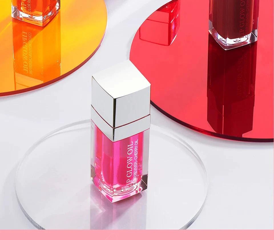Mandotos moisturizing lip balm oil with plumping and exfoliating lip gloss on a neutral background.