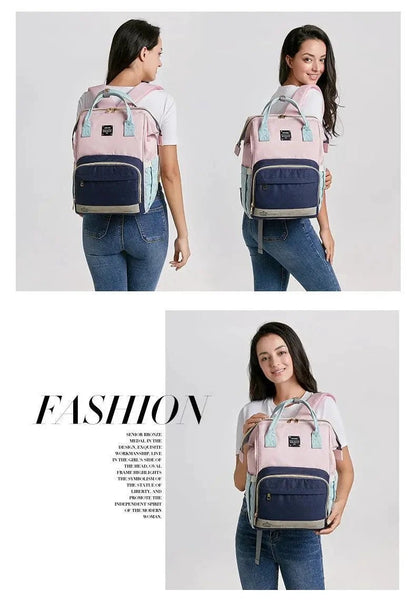 Mandotos Mummy Maternity Bag with multiple compartments and handles, designed for moms to carry baby essentials comfortably.