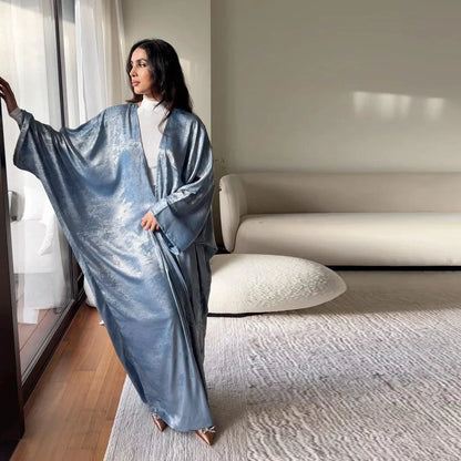 Mandotos Muslim robe abaya in black with intricate embroidery, flowing fabric, and long sleeves, elegant Islamic modest wear.