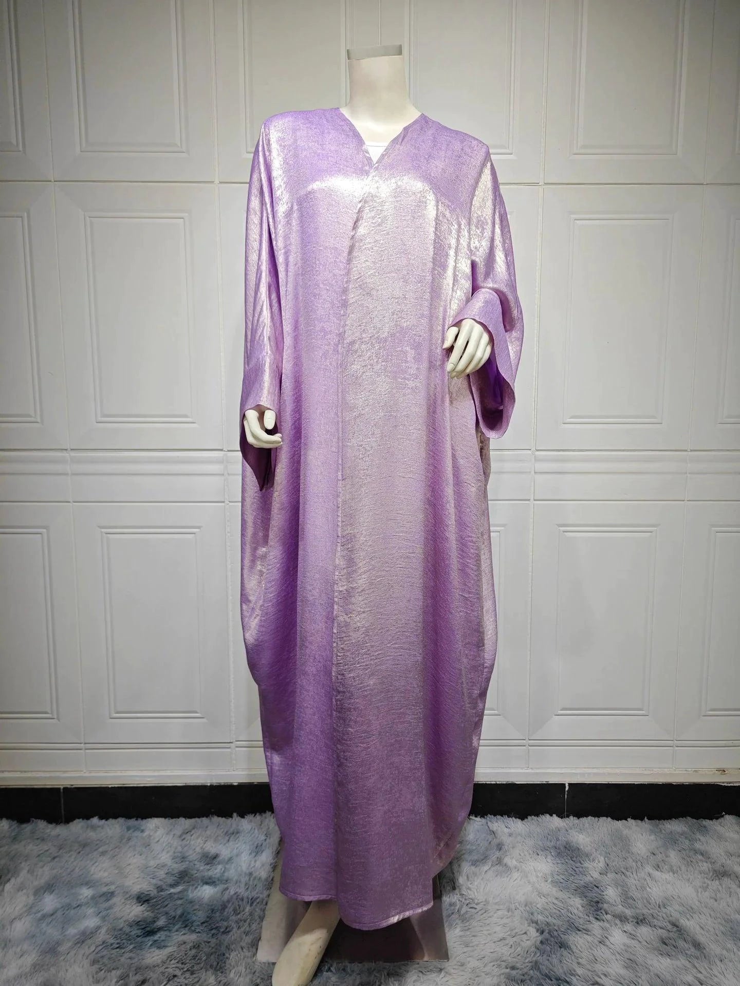 Mandotos Muslim robe abaya in black with flowing fabric and elegant design, full-length traditional Islamic dress.