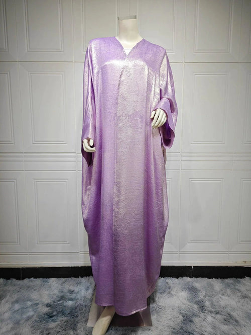Mandotos Muslim robe abaya in black with flowing fabric and elegant design, full-length traditional Islamic dress.
